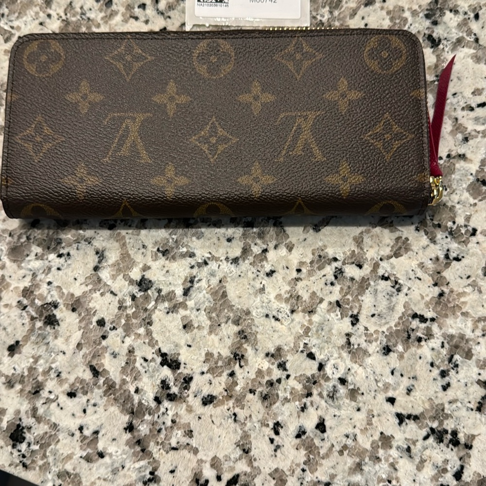 Brand new Louis Vuitton Clemence wallet. Monogram. Fuchsia color inside